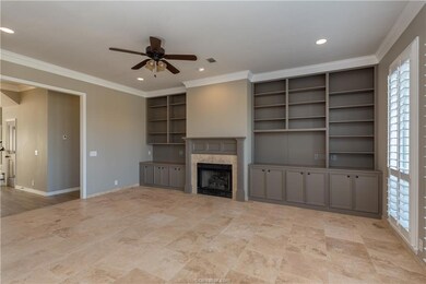 Unfurnished living room featuring crown molding, b