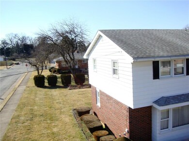 Elevated view showing manicured shrubs.