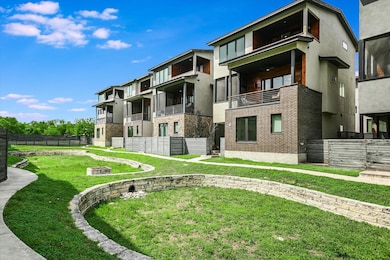 View of property featuring fence and a fire pit