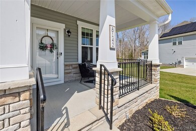 Cute stone front porch with room to sit