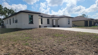 View of front of home featuring stucco siding, a f