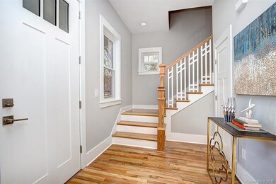 Foyer + custom stair rails