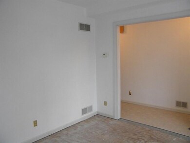Living room to ceramic tiled entry hallway