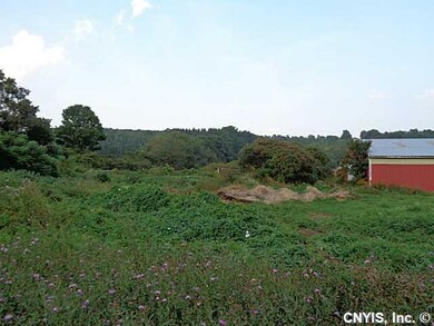 Land. Trees and wildflowers grace the acreage.
