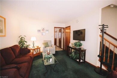 Living room conveniently leads to the kitchen through the doorway in this view.