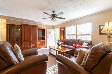 Living room featuring an semi-open floor plan to k