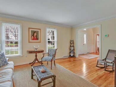 View of the living room ~ two windows facing the f