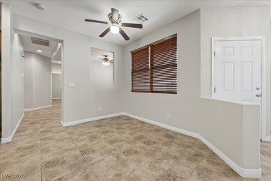 Spare room with ceiling fan, a smoke detector, and