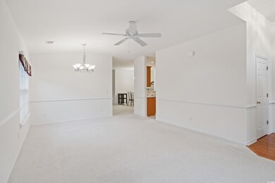 Unfurnished room with carpet floors and ceiling fa