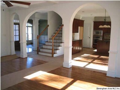 Very open floor plan  with arches.