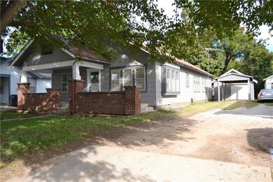 Detached 1 car garage and covered carport with lon