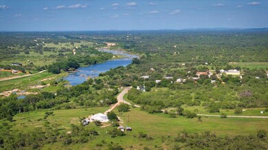 Bird's eye view of a nearby body of water and a f