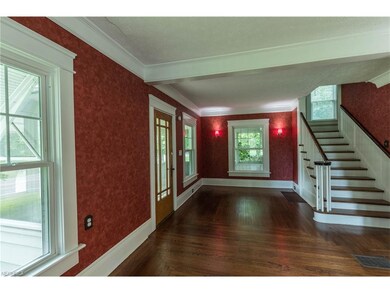 Glass beveled front door, beautiful hardwood floor
