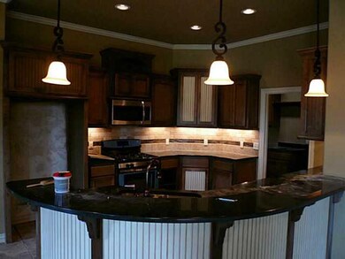 Kitchen. Granite Counters.  Tiled Back Splash.
