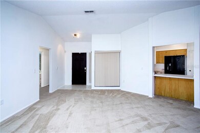 View of front door and foyer entry.  To the left a