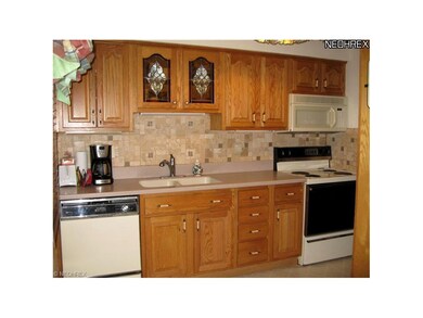 Note the tile backsplash and solid-surface counter