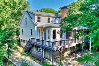 Screened porch and wrap-around deck along rear of 
