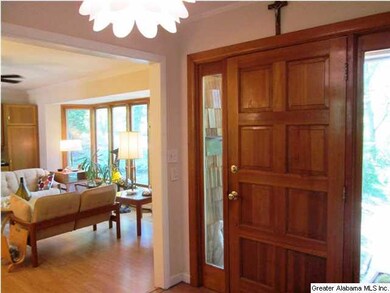 Inside view of front door with living room to left