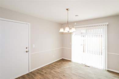 Spare room with hardwood / wood-style floors and a