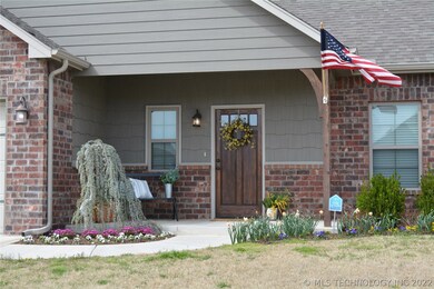 Front porch, beautifully landscaped.