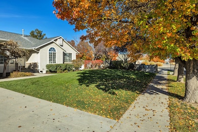 View of home's exterior featuring stucco siding and roof with shingles