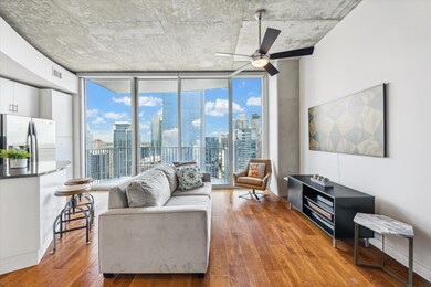 Living room with floor to ceiling windows, a view