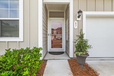 Doorway to property featuring a garage