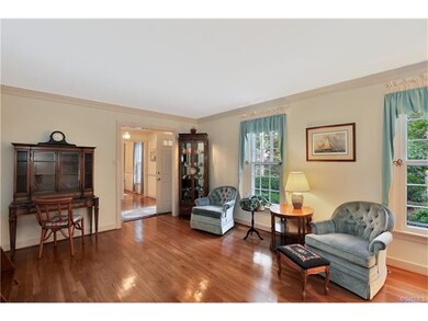 Large formal living room with gorgeous hardwood fl