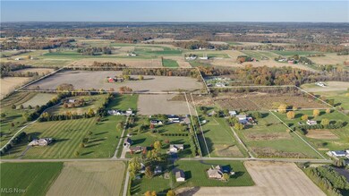 Aerial overview of property's location featuring property boundaries highlighted and rural landscape