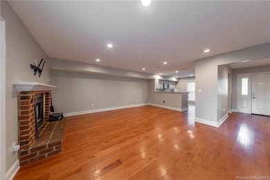 View from the stairs looking toward the kitchen and the front door.