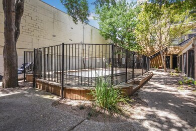View of gate featuring fence