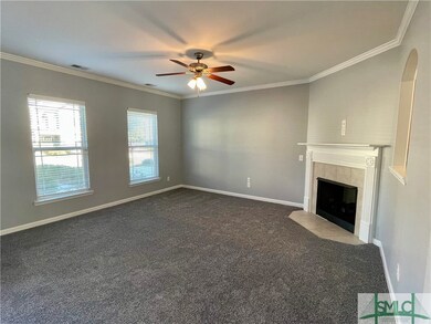 The living room is spacious and has a gas fireplac