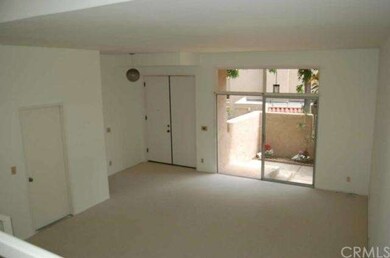 Sun-filled, spacious living room opens to private 