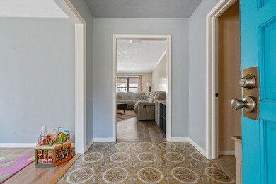The entry way is warm and invited with a eccentric