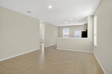 Spare room with light tile patterned floors and recessed lighting