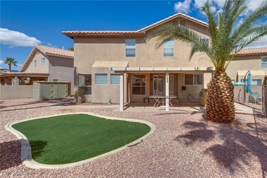 Rear view of property with stucco siding, a tile r