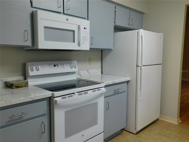 Kitchen showing appliances & cabinets