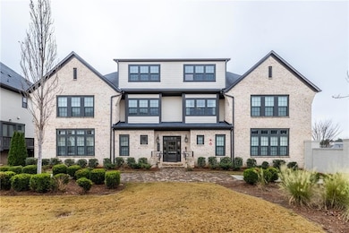 View of front facade featuring brick siding and a front lawn