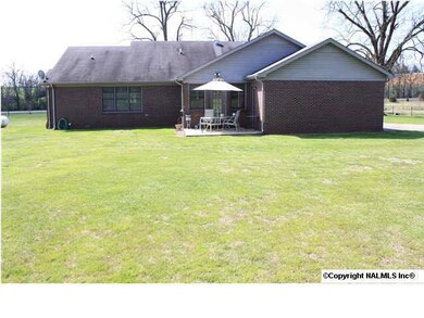 Back View of Home - Nice open patio for your umbrella table and chairs as well as your bbq grill. Spacious yard for outdoor entertaining when the weather is right.