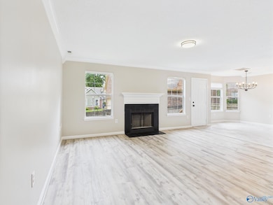 Once you walk in the front door, there will be a 1/2 bath on the right,  the stairs upstairs, and then the view of this nice large family room.