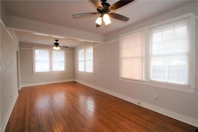 Second view of living and dining area with large w
