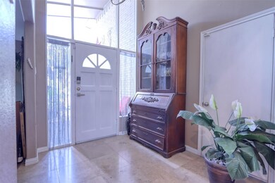 View of entryway with dining room to one side and 