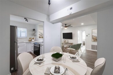 Dining area featuring a ceiling fan, visible vents