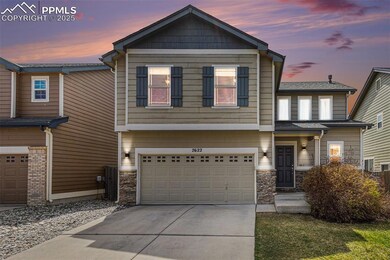 Craftsman-style home featuring driveway, a garage, and stone siding
