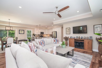 Living room featuring recessed lighting, wood fini