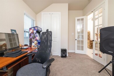 Office space with french doors, carpet floors, and