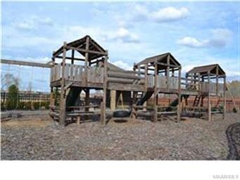 Fenced children's playground.