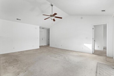 Empty room with light carpet, ceiling fan, and lof