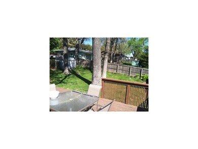 Exterior Back. Fenced back yard with shed.