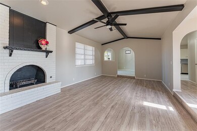Unfurnished living room with a brick fireplace, va